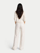 Women's White Cashmere Essential V-Neck Sweater worn by model, back view on white background