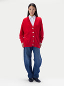 A bright red knit cardigan sweater with a V-neck, long sleeves, and a front button closure, displayed flat against a light gray background. The brand label 'GOBI' is visible inside the collar.