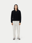 Black cashmere sweater with collar on a light gray background #color_black