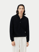 Black cashmere sweater with collar on a light gray background #color_black