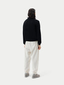 Black cashmere sweater with collar on a light gray background #color_black