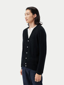 Men's Black Cashmere Polo Sweater  worn by model, side view on white background