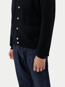 Men's Black Cashmere Polo Sweater  worn by model, detail view on white background