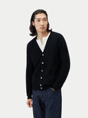 Men's Black Cashmere Polo Sweater  worn by model, detail view on white background