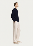Men's Navy Cashmere Crewneck Sweater worn by model, side view on white background