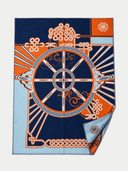 A square silk scarf featuring a complex geometric and ornamental pattern in navy blue, orange, and light blue, with one corner folded over to show the reverse side.