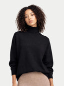 Women Black T-Neck Cashmere Sweater worn by model, detail view, on white background