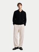 Men's Black Cashmere Polo Sweater worn by model, front view on white background
