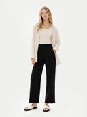 Women's Cashmere Pants Black worn by model, front view on white background