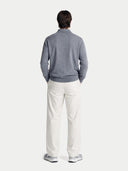 Man wearing a gray cashmere sweater over a collared shirt on a white background. #color_gray