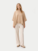 Women's Beige Cashmere  Knitted Poncho worn by model, front view, on white background