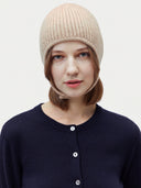 Model wearing the Natural Color Knitted Aviator Cap in Beige, close front view