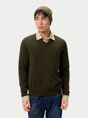 Model wearing the Seamless Cashmere Rib Knit Beanie in Muted Green, full-length front view