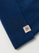 The Seamless Cashmere Rib Knit Beanie in Deep Blue, close-up of the cashmere knit