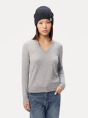Model wearing the Seamless Cashmere Rib Knit Hat in Midnight Blue, full-length front view