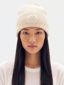 Model wearing the Women's Cashmere Ribbed Beanie in White, front view