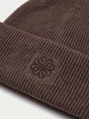 Close-up of the Women's Seamless Cashmere Ribbed Beanie in Cocoa, showing the turn-up cuff with the embroidered monogram and the rib knit