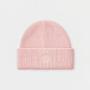 A ribbed knit beanie hat in a light beige or cream color, featuring a small tonal embroidered geometric logo on the front of the folded cuff, set against a solid off-white background.