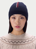 Model wearing the Cashmere Intarsia-Stripe Beanie in Navy, front view