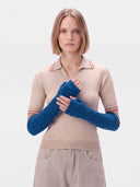 Model wearing the Cashmere Rib-Knit Fingerless Gloves in Bright Blue, front view