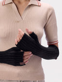 Model wearing the Cashmere Rib-Knit Fingerless Gloves in Black, close front view