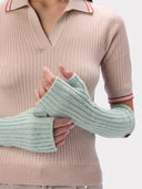 Model wearing the Cashmere Rib-Knit Fingerless Gloves in Morning green, close front view