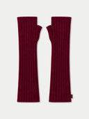 A pair of ribbed knit fingerless arm warmers in deep burgundy, displayed flat against a light gray background.