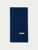 The Fisherman Knit Scarf in Deep Blue, flat lay front view