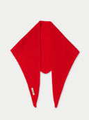 Red knitted scarf on a light gray background