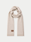 A light beige knit scarf with a small brown leather brand patch reading 'Gobi' on one end, displayed against a clean off-white background.