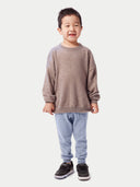 Model wearing the Kids Cashmere Track Pants in light gray, full-length front view