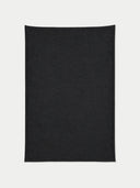 Flat lay of the Natural Color Cashmere Knit Blanket in charcoal.