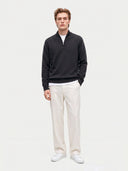Model wearing the Seamless Cashmere Lightweight Crewneck Sweater in Charcoal, full-length front view