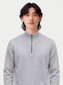 Model wearing the Seamless Cashmere Lightweight Crewneck Sweater in Light Gray, close front view