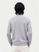 Model wearing the Seamless Cashmere Lightweight Crewneck Sweater in Light Gray, back view