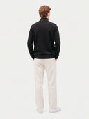 Model wearing the Seamless Cashmere Lightweight Crewneck Sweater in Black, back view