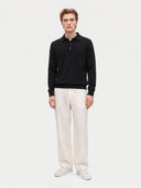 Model wearing the Cashmere Classic Polo Sweater in Black, full-length front view