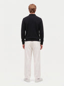 Model wearing the Cashmere Classic Polo Sweater in Black, back view