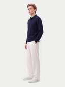 Model wearing the Cashmere Classic Polo Sweater in Navy, three-quarter side view