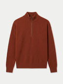 A rust-colored knit quarter-zip sweater with a mock neck collar, displayed flat against a light gray background.