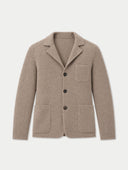 A taupe knit blazer-style cardigan with a notched lapel, three dark buttons, a chest pocket and two patch pockets, shown flat against a light gray background.