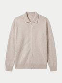 A light beige knit zip-up cardigan with a polo-style collar, ribbed cuffs, and a ribbed hem, shown against a light gray background.