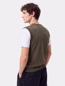 Back view of a man wearing the olive green Timeless V-Neck Cashmere Vest over a white T-shirt