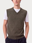 Close-up of the olive green Timeless V-Neck Cashmere Vest showing the ribbed V-neck and knit texture