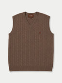 A brown cable-knit V-neck sweater vest with a small embroidered logo on the left chest, displayed flat against a light gray background.