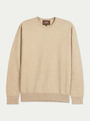 A beige crewneck knit sweater with long sleeves and ribbed cuffs and hem, shown flat against a light off-white background. The brand label 'GOBI' is visible inside the collar.