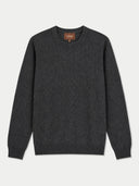 A dark charcoal gray knit crewneck sweater with ribbed cuffs and hem, displayed flat against a light gray background. The brand label inside the collar reads 'Gobi'.