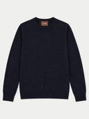 A dark navy blue crewneck sweater with long sleeves, laid flat against a light gray background. A small brown brand label reading 'GOBI' is visible inside the collar.