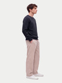 Model wearing the Cashmere Fine Crewneck Sweater in Navy, three-quarter side view