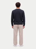 Model wearing the Cashmere Fine Crewneck Sweater in Navy, back view